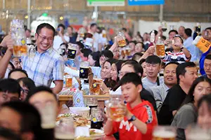Yunnan Prints: Chinese tourists enjoy German beer during the China tour of Oktoberfest Munich