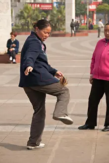 Badminton Prints: A Chinese woman juggling a shuttlecock, Luzhi, Guizhou Province, China