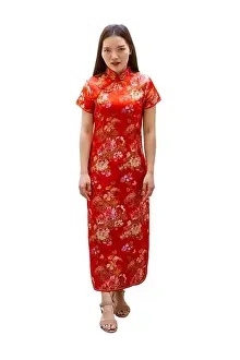 Chinese New Year Prints: Chinese women dress with Cheongsam or Qipao traditional outfit for festive seasons Chinese New Year isolated on white