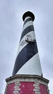 Carolina Prints: *Chipping Away the Old* is a photograph from 2013 showing conservation efforts on the *Cape Hatteras Lighthouse*