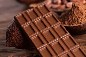 Temptation Prints: Chocolate bar, candy sweet, cacao beans and powder on wooden background