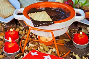 Chocolate fondue with fruit and biscuits