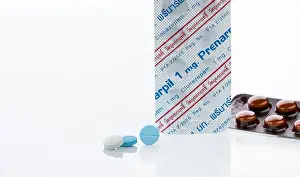 Panic Prints: CHONBURI, THAILAND-JULY 11, 2023: Prenarpil round tablet pills and blister pack