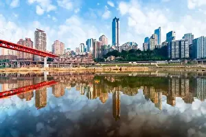 Chongqing, China cityscape at the Jialing River and Qianximen Bridge