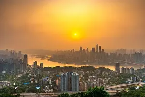 Chongqing, China downtown city skyline over the Yangtze River just before sunset