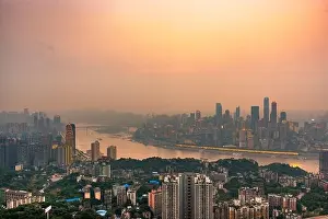 Chongqing, China downtown city skyline over the Yangtze River just before sunset