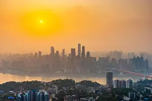 Chongqing, China downtown city skyline over the Yangtze River just before sunset