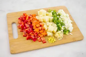 Potatoes Prints: Chopped Vegetables on a Bamboo Cutting Board
