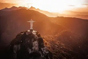Carioca Prints: Christ the Redeemer Statue on top of Corcovado Mountain at sunset - Rio de Janeiro, Brazil