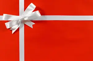 Wrap Prints: Christmas border frame gift ribbon in white satin on red paper background horizontal