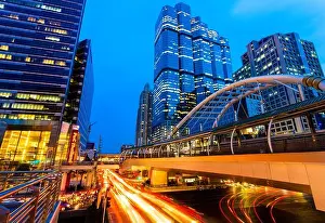 Sathorn Prints: Cityscape view of Bangkok traffic and skyscrapers at sunset, Thailand