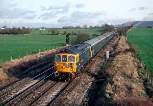 A class 33 diesel locomotive number 33116 "Hertfordshire Rail Tours" and 4TC sets numbers 410
