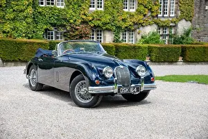 Convertible Prints: Classic British Jaguar XK150 cabriolet parked in a Yorkshire village on a sunny Summer day