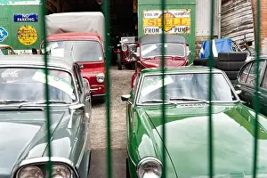 Vintage Cars Prints: Classic vintage cars stored in garage with Shell petrol station signage