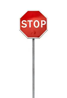 Classical Stop road sign on a metal pole isolated on white, vertical photo