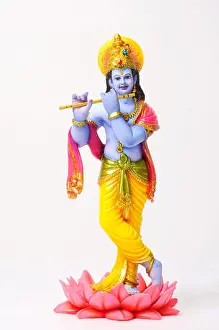 Lords Prints: Clay statue of god krishna playing flute standing on lotus