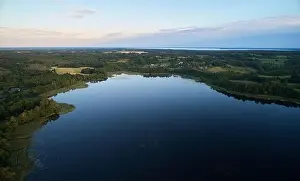 Clean pond aerial view on sunset light in natural landscape