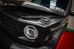 Hood Prints: Close Up of Black Mercedes G Class SUV with Hood Partially Open