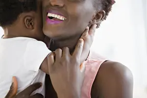 20 25 Prints: Close up of Black mother holding son