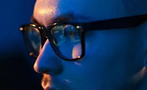 Optics Prints: close up of hacker in glasses looking at screen