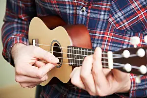 Practising Prints: Close Up Of Man Playing Ukulele