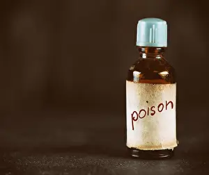 Apothecary Prints: close up of old bottle with poison. Dark background