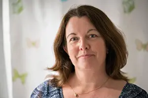 Well Being Prints: Close up portrait of a 50 year old woman with brown hair