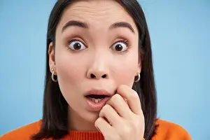 Close To Prints: Close up portrait of amazed asian girl