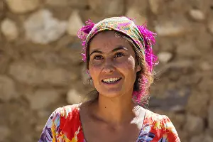 Shawl Prints: Close up portrait of smiling Pamiri / Badakhshani woman wearing colourful head scarf