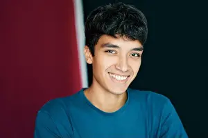 Origin Prints: Close up portrait of young smiling man looking to camera. Man beauty concept