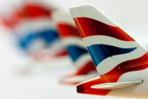 Planes Prints: Close up of a row of British Airways tail plane logos on metal models of passenger planes