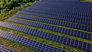 Close up solar power station panels in a row in the fields green energy at sunset landscape electrical ecology