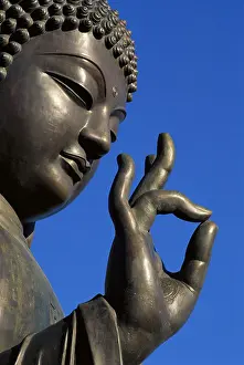 Wise Prints: Close up of statue of Buddha showing hand and face