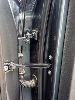 Flexible Prints: close up of typical auto car door hinge and mechanical and electrical connections detail