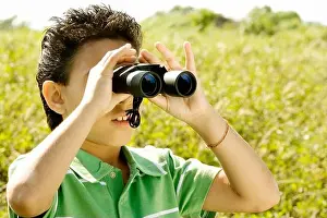 Tween Prints: Close-up of a boy looking through a pair of binoculars