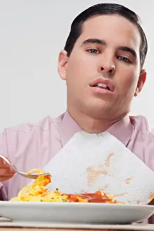 Business Person Prints: Close-up of a businessman eating pasta