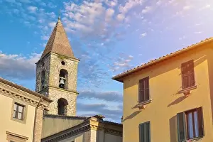 Close-up of colorful buildings, bell tower and rooftops in a blue sunny day at Umbertide, a gracious little town near Perugia, Italy
