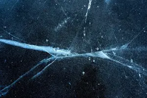 Scratched Prints: Close-up of cracked ice on lake surface