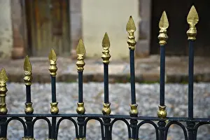 Sierra Prints: Close-up detail of a custom made gold and black wrought iron gate on Plaza Hidalgo in Real de Catorce
