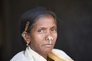 Maturity Prints: Close-up of an old tribal woman smoking bidi