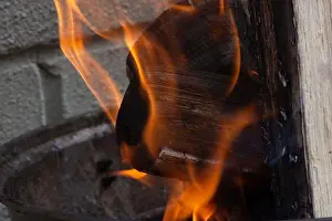 Flames Prints: A close‑up photograph of bright orange flames rising against a dark background