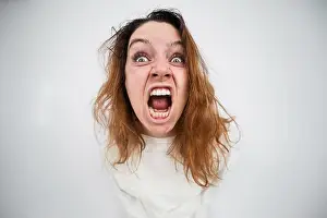 Sleepy Prints: Close-up portrait of insane woman in straitjacket on white background