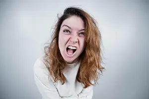 Sleepy Prints: Close-up portrait of insane woman in straitjacket on white background