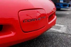 Transport Vehicle Prints: A close-up of a red Corvette with black lettering logo