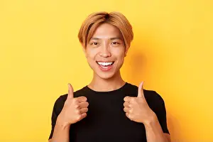 Approval Prints: Close-up of satisfied, happy asian guy in black t-shirt