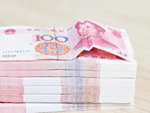 Appreciating Prints: close-up of stack of 100-yuan chinese banknotes