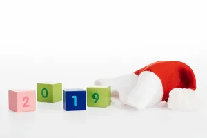Santa Hat Prints: close-up view of 2019 symbol on cubes and santa hat isolated on white