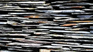 Concrete Construction Prints: Close-up detail view of an old traditional stone wall built from schist in Piodão