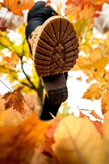 Autumn Leaves Prints: Close-up of a woman foot in boots