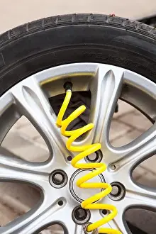 Gauge Prints: Close up view at yellow hose of pneumatic pump connected to valve core